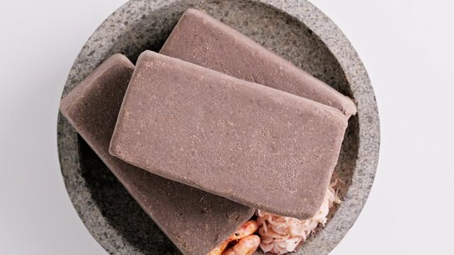 Traditional Indonesian Shrimp Paste Terasi on mortar stone