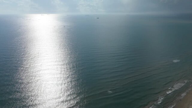 Aerial ocean view with ships on the horizon heading to the Port of Tuxpan, Veracruz, Mexico, 4K