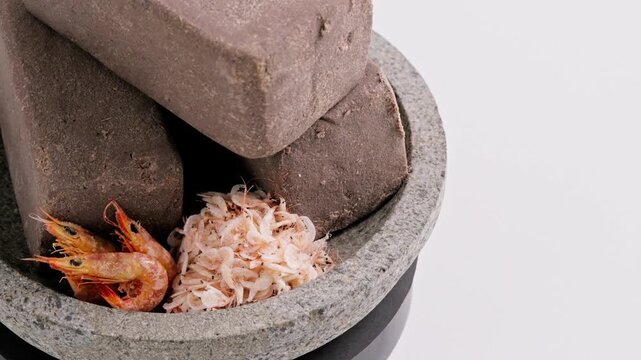 Traditional Indonesian Shrimp Paste Terasi on mortar stone