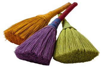 Three colorful, natural fiber brooms, stacked.  The handles are wrapped with contrasting colored cords.  The bristles are a vibrant yellow-orange,  purple, and yellowish-green