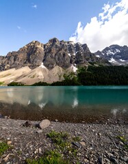 Mountain lake reflecting a blue sky