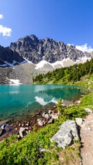 Mountain lake reflecting peaks (1)