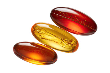 Three translucent, oval-shaped capsules, amber and reddish-orange in color
