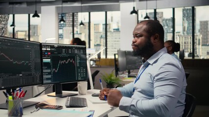 Trader in emotional turmoil concerned by investment portfolio value drop after unexpected market crash. Anxious man distressed by stock exchange account shares price fluctuation, camera A - Powered by Adobe