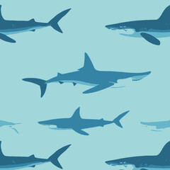 Obraz premium A pattern of blue shark silhouettes swimming in a light blue ocean background.