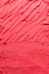 Top view of red buttercream for decorating cake, silky smooth american buttercream with patterns, overhead view of smooth red buttercream