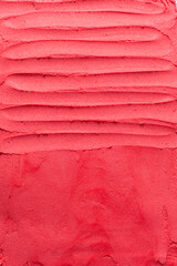 Top view of red buttercream for decorating cake, silky smooth american buttercream with patterns, overhead view of smooth red buttercream