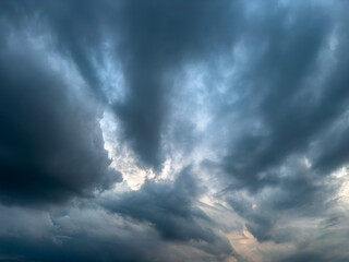 Stormy rainy grey blue clouds .