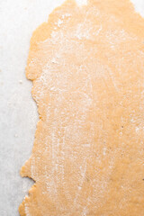 Nigerian Chin chin dough on a white granite countertop, Raw chin-chin on a chopping board, process of making chin chin achomo or klenat	