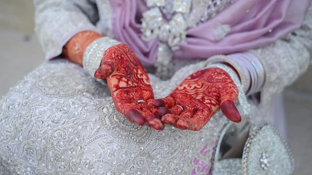 Bridal Mehndi Hands and jewelry closeup during Outdoor Wedding Photoshoot 