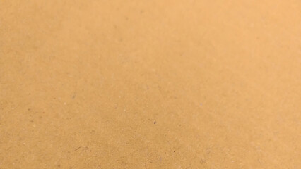 Background of brown kraft paper or cardboard texture. old paper sheet, parchment or papyrus surface.