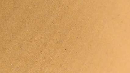 Background of brown kraft paper or cardboard texture. Abstract pattern of beige rough carton, old paper sheet.