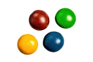Four brightly colored, round candies arranged in a symmetrical pattern against a black background.  Each candy displays a smooth, glossy surface and a distinct, vibrant hue