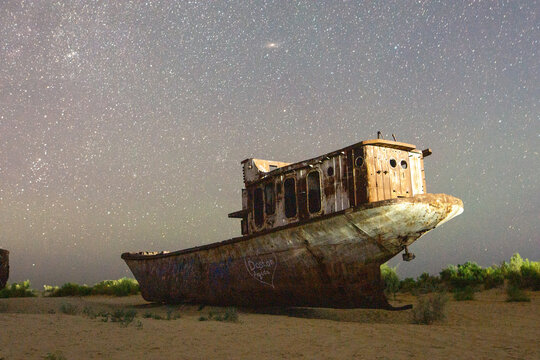 Abandoned Aral Sea Boat Under the Stars - Powered by Adobe