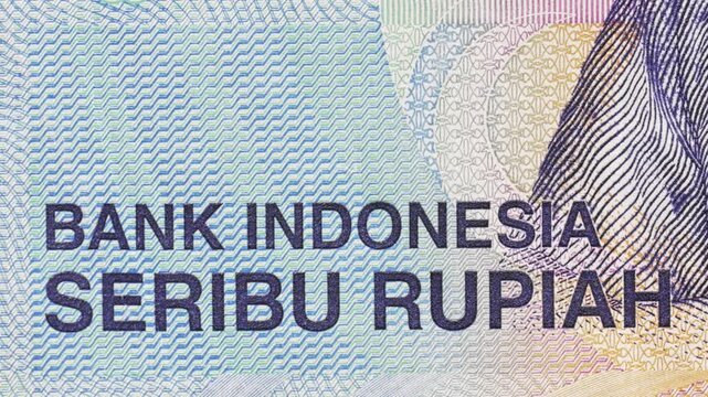 Close-up pan highlighting &ldquo;Bank Indonesia&rdquo; and &ldquo;Seribu Rupiah&rdquo; text with guilloche patterns