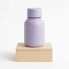 A purple colored tumbler flask adorned with delicate hand-painted flowers, placed alongside wooden boxes.