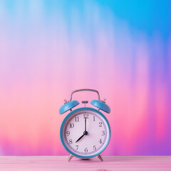 alarm clock on a table  with pastel color background
