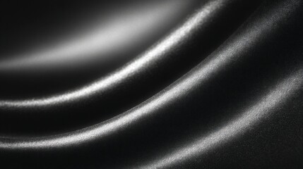 Abstract close up of smooth black satin fabric with elegant light reflections and subtle textures