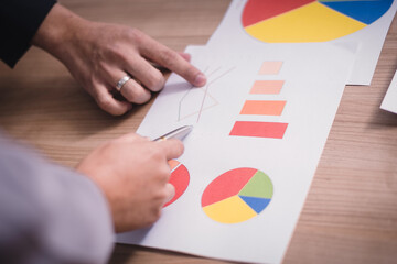 Teamwork with business people analysis cost graph in meeting room