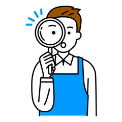 虫眼鏡を覗くエプロン姿の男性