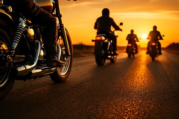 Naklejka premium Motorcyclists ride into a vibrant golden sunset, casting long shadows and a sense of freedom.