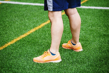 Fototapeta premium sport person standing on green sport field