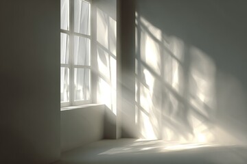 Obraz premium Sunlight streams through a window, casting shadows on a pale room