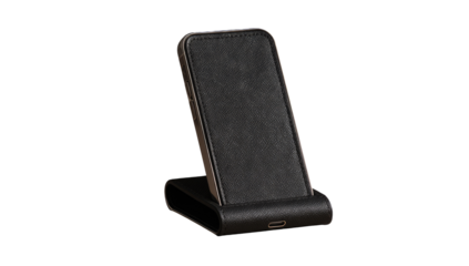 Dark gray smartphone on a charging stand