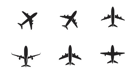 Airplane silhouettes in various orientations on white background