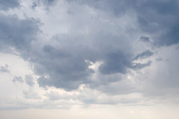 Dark gray clouds filling the sky, signaling an approaching storm or heavy rain, creating a moody and atmospheric weather scene.