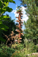 Fototapeta premium Crossroad signpost in the forest showing the way