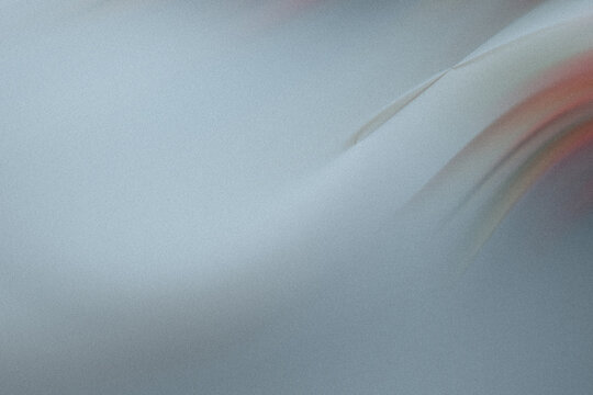 A grainy gray abstract background with smooth, blurred curves creates a modern and artistic textured surface