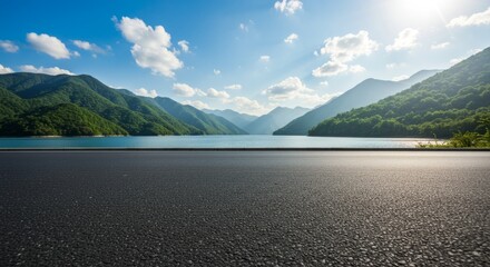 Lake view mountain landscape with asphalt road under blue sky mountain range horizon