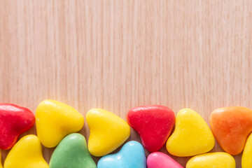 Valentines Day background with hearts shaped on a wooden table