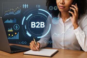 Businesswoman analyzing B2B data with futuristic digital interface and graphs on abstract background during phone call at desk in office setting.