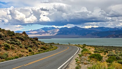 Scenic drive along Mono Lake with dramatic clouds and the Sierra Nevada backdrop captures the