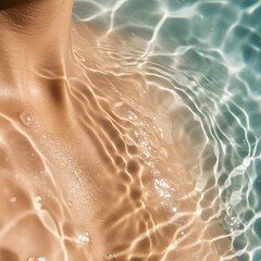 Fototapeta premium Woman's bare shoulder submerged in water with reflections and ripples 