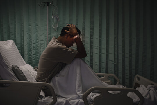 Man with heavy headache in hospital