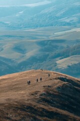 A group of friends walking up a gentle hillside to enjoy the midday view Rolling landscapes stretch below The mood feels peaceful and rewarding, Generative AI 