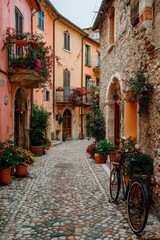Obraz premium Charming Narrow Cobblestone Street in a Romantic Italian Village