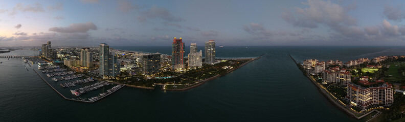 Obraz premium Aerial panoramic view of Miami skyline. Panoramic cityscape of Miami with coastal skyscrapers. Panoramic view of Miami Beach from above. Iconic landmarks line of Miami coastline. Miamis famous skyline