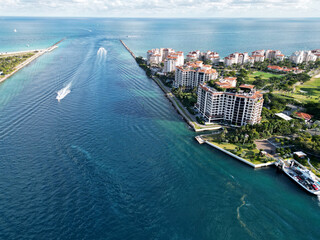 Luxury yacht cruising near Miami skyline. Aerial view of boats on turquoise waters in Miami. Yacht retreat in South Florida Miami. Miami cityscape with sailing vessels. Waterfront Miamis panorama.