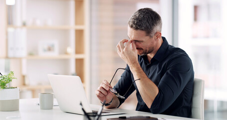 Businessman, laptop and stress with headache or eye strain in office for mistake or burnout. Man, employee or migraine with vision problem for overworked pressure, deadline or fatigue in workplace