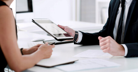 Business, hands and people with tablet, financial agency and conversation with profit increase. Employees, broker and consultant in office, fintech and internet with revenue, research and investment