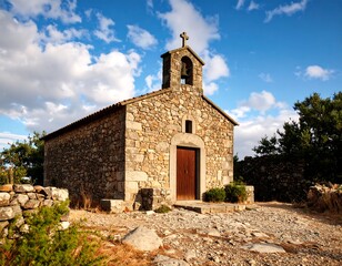 Naklejka premium Stone chapel under a partly cloudy sky