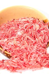 Small dried shrimp for cooking on white background