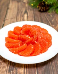 Sliced grapefruit arranged on a plate