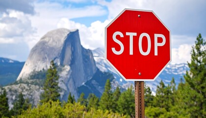 Iconic Stop Sign Stands Before Majestic Half Dome in Yosemite National Park.