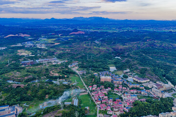 City power plant and large smokestacks at night
