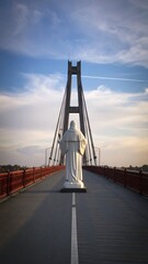 Statue on Bridge at Sunset